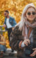Four friends having a good time in autumn park